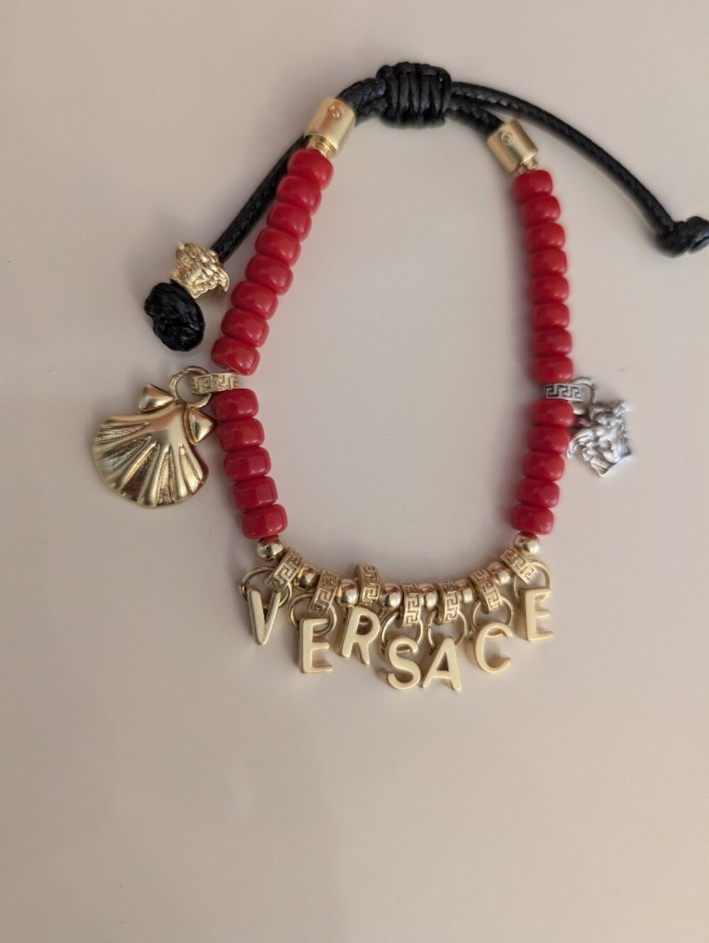 Versace Red Beaded Bracelet with Gold Letter and Charm Accents